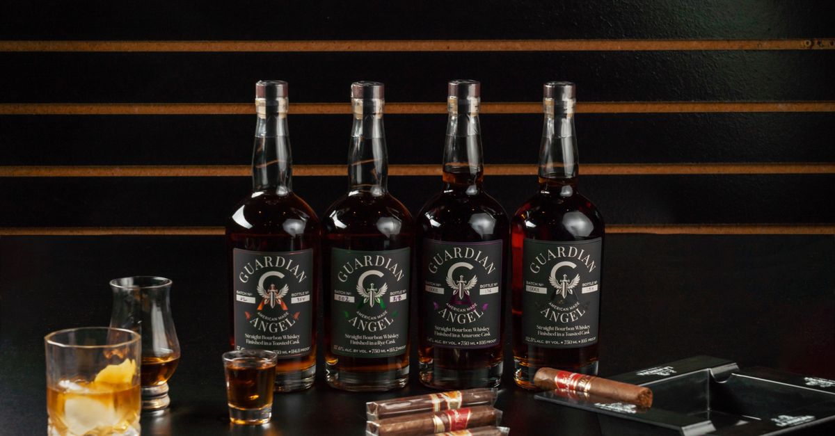 A stylish display of Guardian Angel whiskey bottles with cigars in a New Orleans bourbon bar setting.