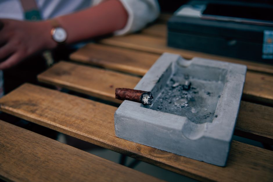 Deep stainless steel cigar ashtray with four cigar rests