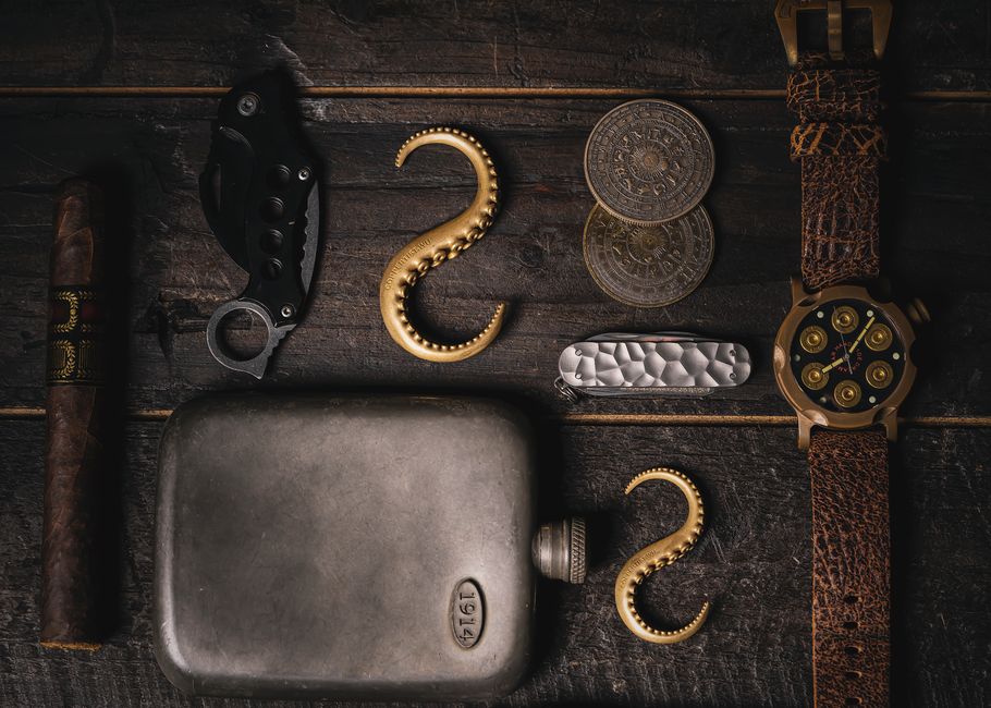 Boxed cigar gift set with cutter, lighter, ashtray, and case